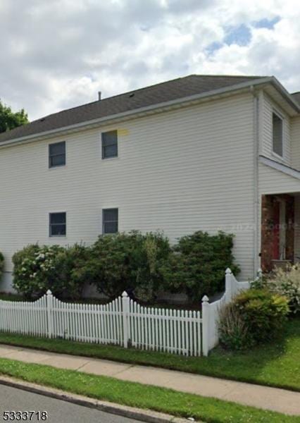 view of home's exterior with a fenced front yard