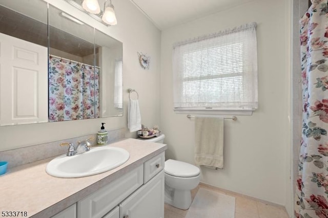 bathroom with tile patterned flooring, a shower with shower curtain, vanity, and toilet