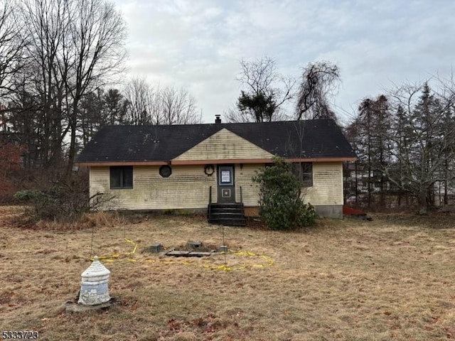 ranch-style home with a front yard