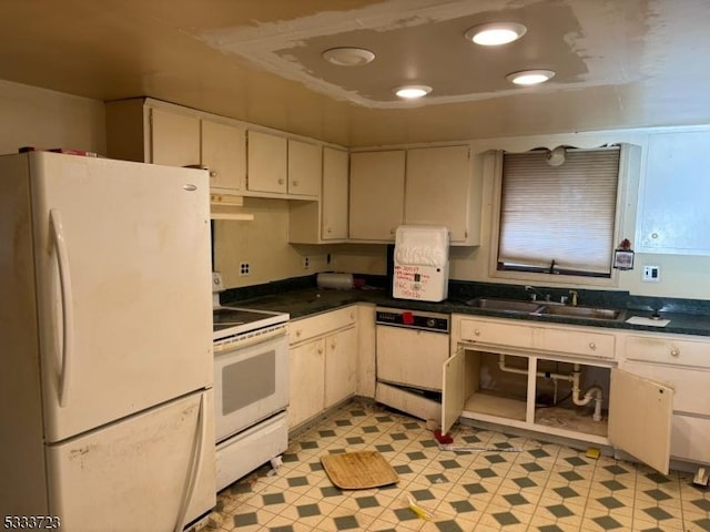 kitchen featuring sink and white appliances