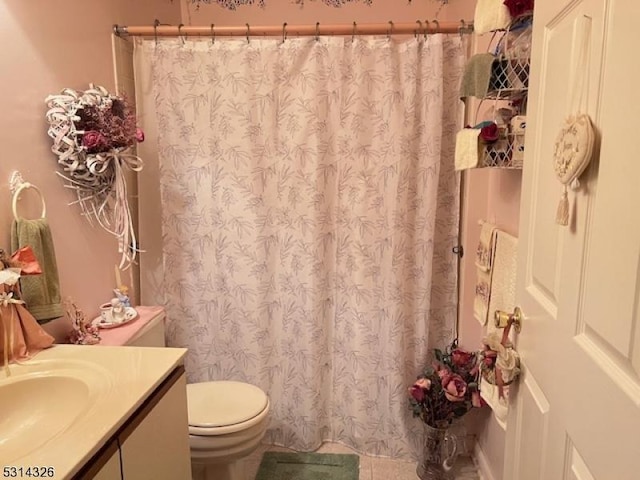 bathroom featuring toilet and vanity