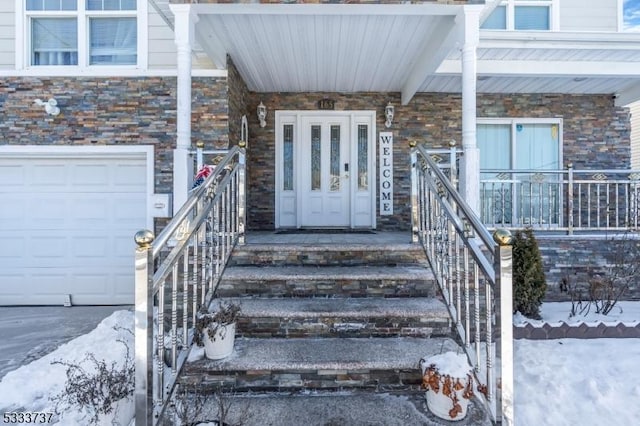 doorway to property featuring a porch and a garage