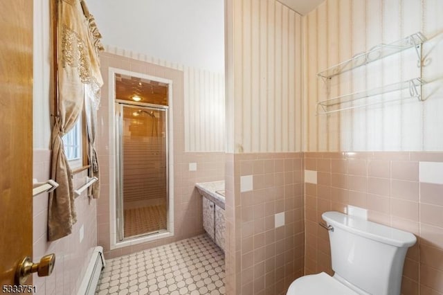 bathroom featuring tile walls, tile patterned flooring, a baseboard radiator, toilet, and walk in shower