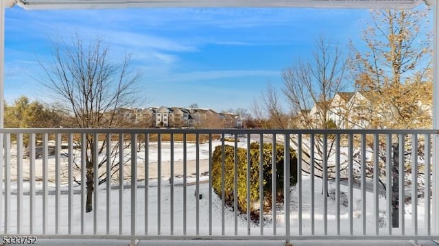 view of snow covered gate