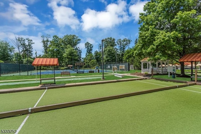 view of property's community featuring a gazebo and tennis court