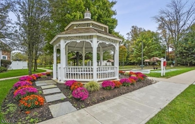 view of home's community with a gazebo and a yard