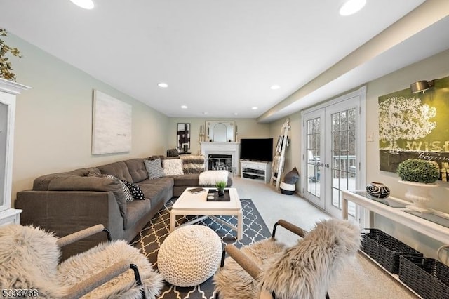 living room featuring light colored carpet and french doors