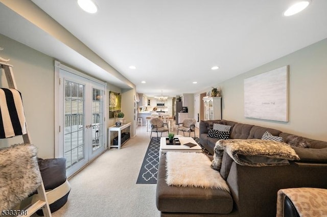 living room with french doors and light carpet