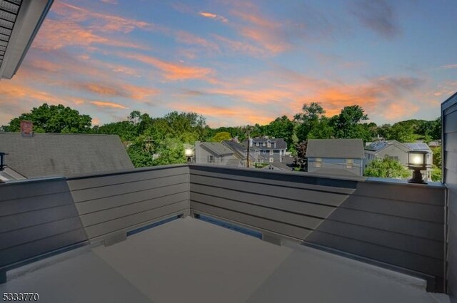 patio terrace at dusk with a balcony