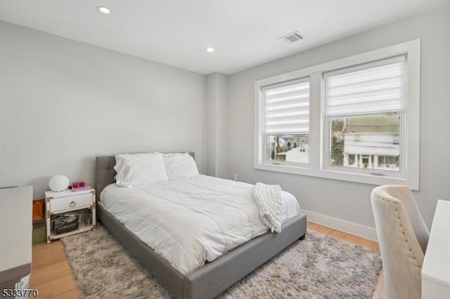 bedroom with light hardwood / wood-style flooring