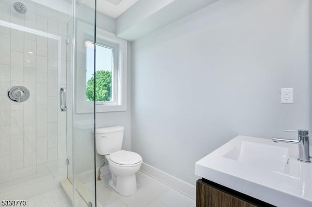 bathroom featuring tile patterned flooring, toilet, vanity, and walk in shower