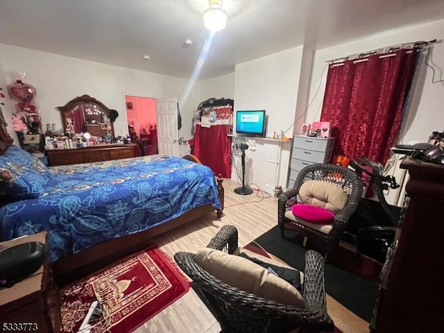 bedroom with hardwood / wood-style flooring