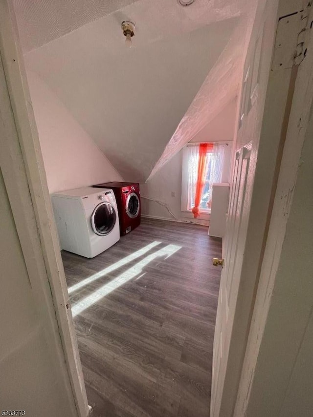 laundry area featuring dark hardwood / wood-style floors and washer and clothes dryer