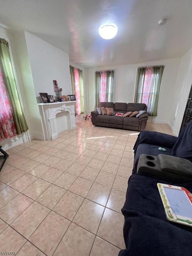 tiled living room with a wealth of natural light