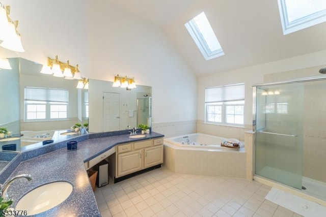 bathroom featuring vanity, shower with separate bathtub, a healthy amount of sunlight, and tile patterned floors