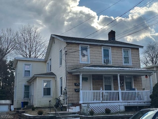 front facade with cooling unit and covered porch