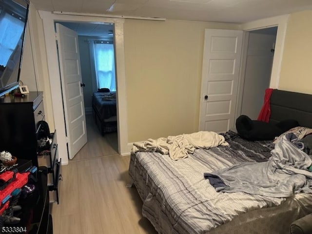 bedroom with light hardwood / wood-style floors