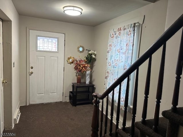 view of carpeted entrance foyer