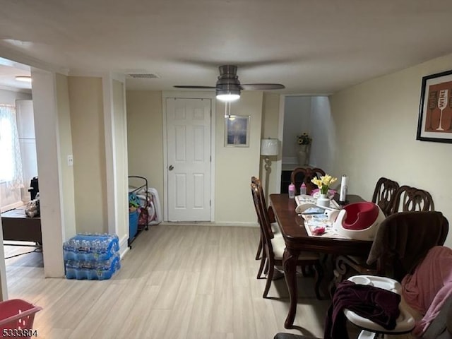 dining space featuring light hardwood / wood-style floors and ceiling fan