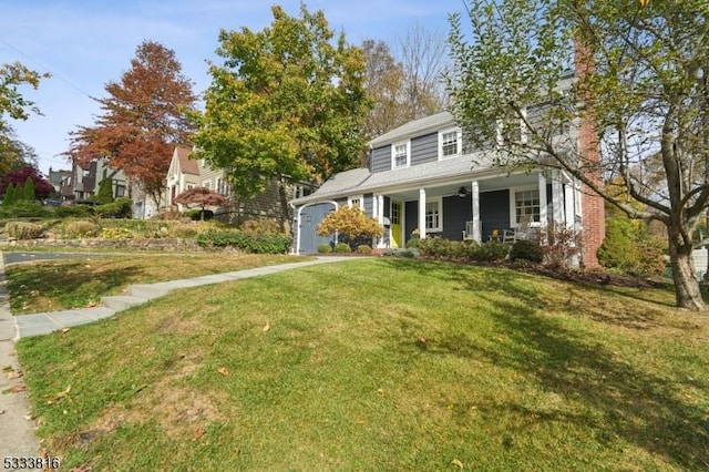 view of front facade with a porch and a front lawn