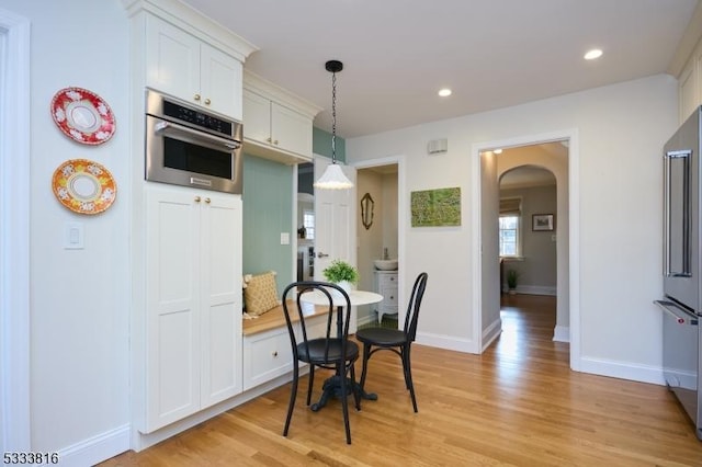 dining area with light wood-type flooring