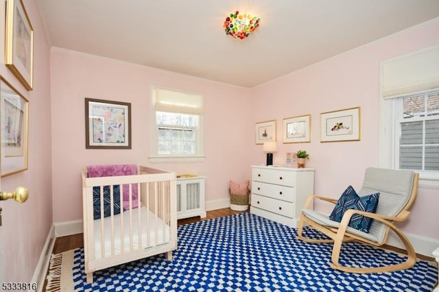 bedroom with hardwood / wood-style flooring