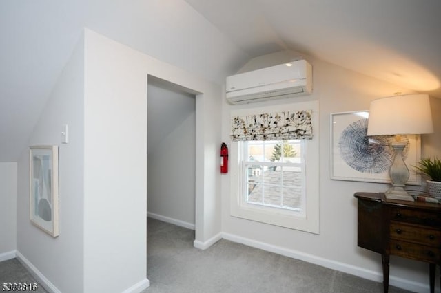 hallway with carpet flooring, a wall mounted AC, and vaulted ceiling