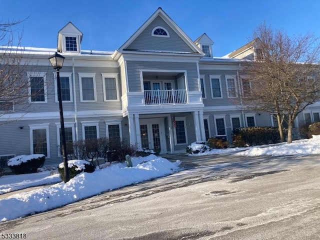 view of front of property with a balcony