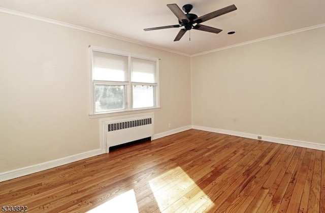 unfurnished room featuring hardwood / wood-style flooring, crown molding, radiator heating unit, and ceiling fan