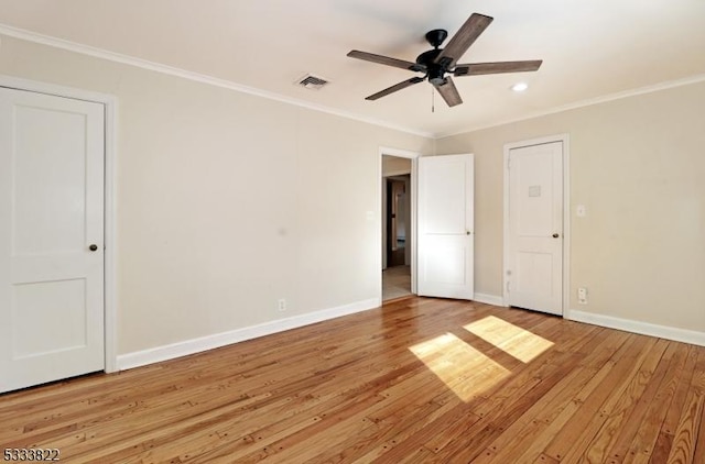 interior space featuring ceiling fan, crown molding, and light hardwood / wood-style floors