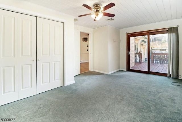 unfurnished bedroom featuring wooden ceiling, carpet flooring, a closet, ceiling fan, and access to exterior