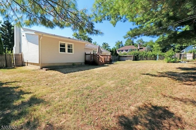 view of yard featuring a wooden deck