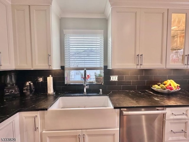 kitchen featuring decorative backsplash, sink, white cabinets, and dishwasher