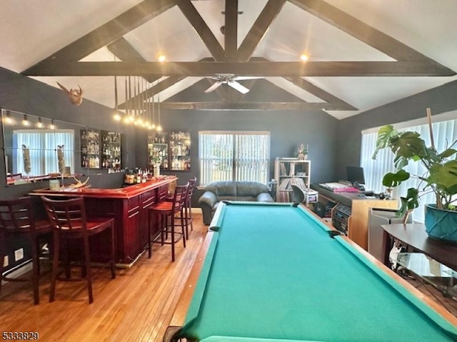 game room with billiards, wood-type flooring, bar area, and vaulted ceiling with beams