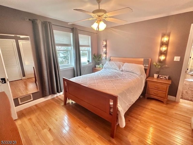 bedroom featuring ceiling fan and light hardwood / wood-style flooring