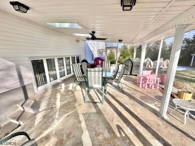 view of patio featuring ceiling fan