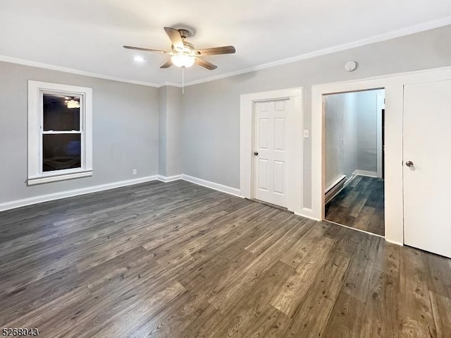 unfurnished bedroom with ceiling fan, a baseboard heating unit, dark hardwood / wood-style floors, and crown molding