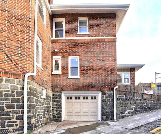 view of side of home with a garage