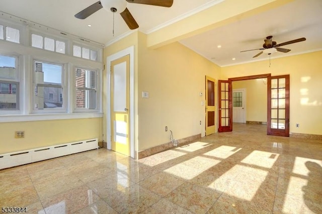 spare room featuring ornamental molding, a baseboard radiator, and french doors