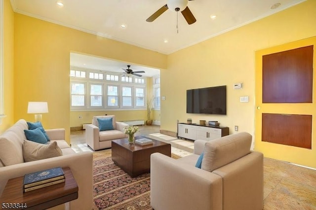 living room featuring ceiling fan and ornamental molding