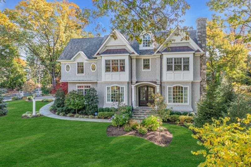 view of front of house with french doors and a front yard