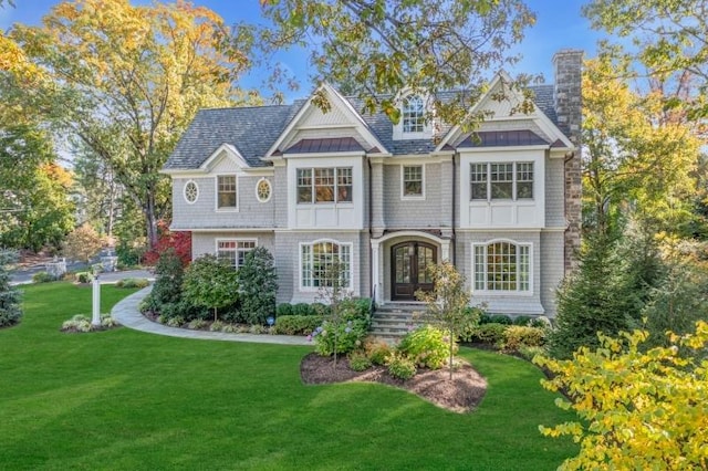 view of front of house with french doors and a front yard