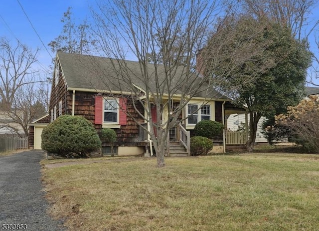 view of front facade with covered porch and a front yard