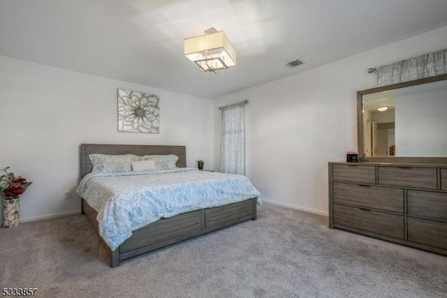 bedroom featuring light carpet