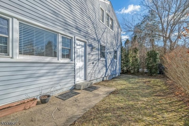 view of home's exterior with a lawn