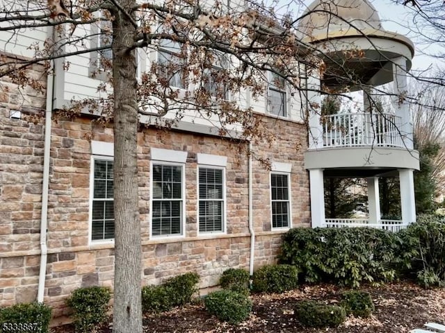 view of property exterior with a balcony