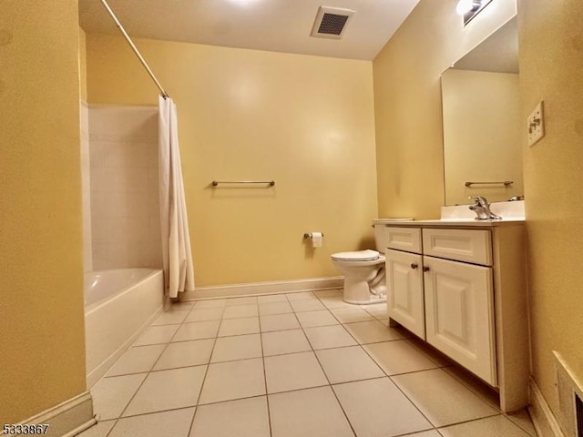 full bathroom featuring toilet, tile patterned floors, and shower / bath combo with shower curtain