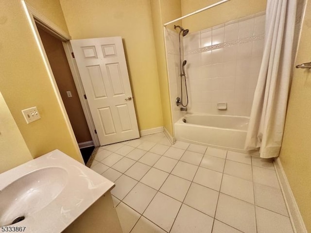 bathroom featuring sink, shower / bath combination with curtain, and tile patterned floors