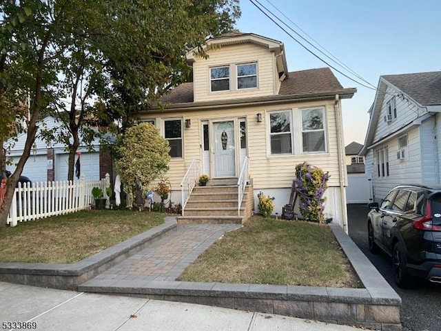 bungalow with a front yard