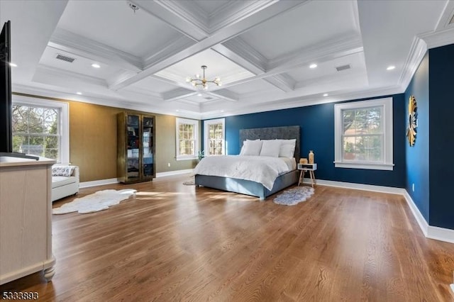 bedroom with hardwood / wood-style flooring, beam ceiling, crown molding, and coffered ceiling